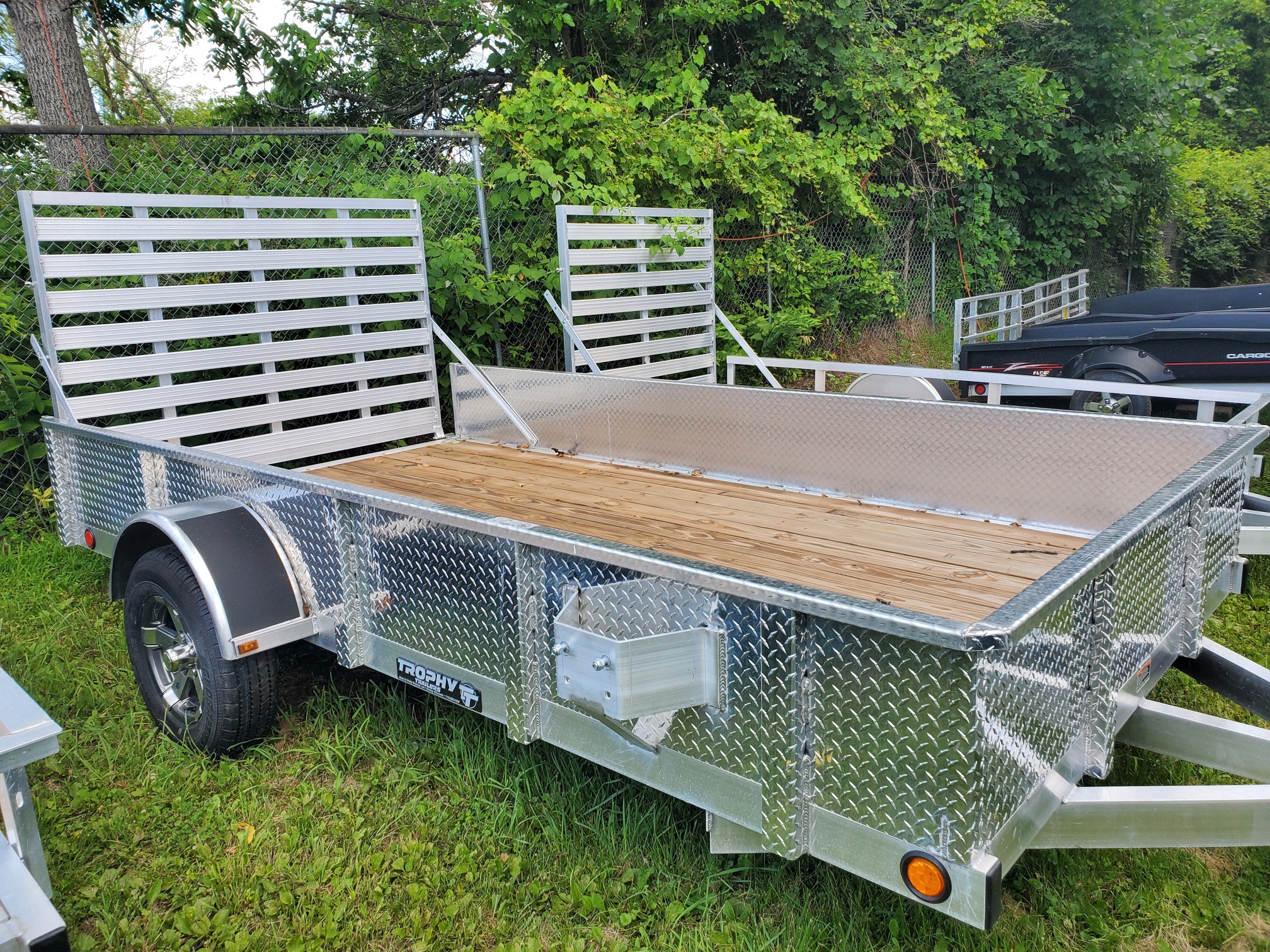 2025 Trophy Trailers 6.5X12DP TI  Diamond plate sides, tip in ramp, alloy wheels!