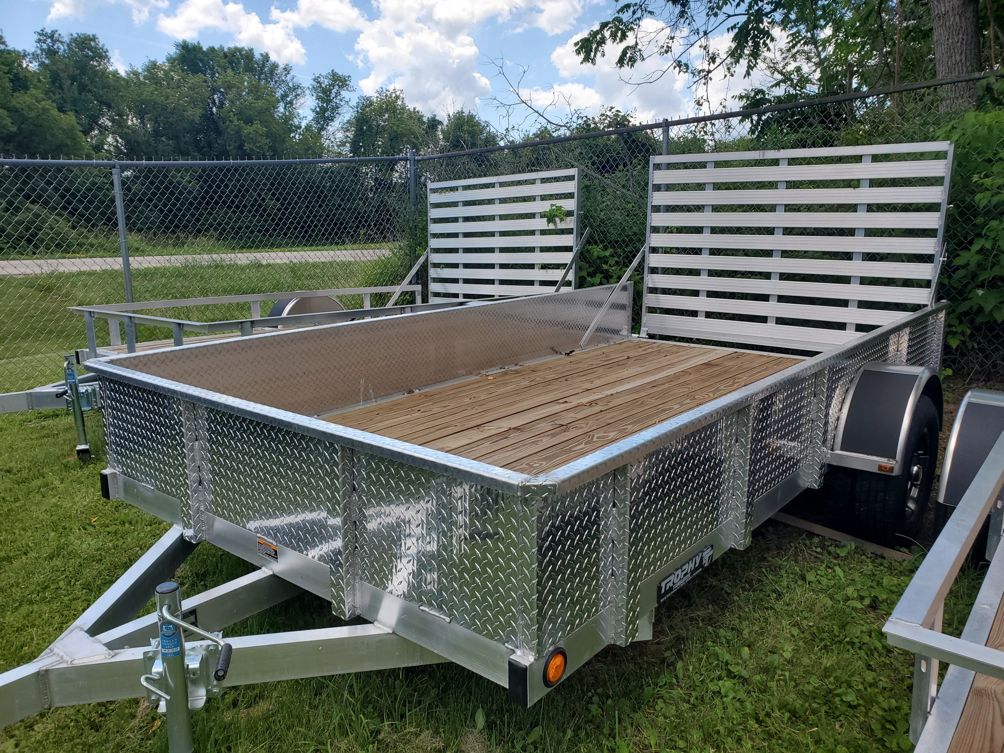 2025 Trophy Trailers 6.5X12DP TI  Diamond plate sides, tip in ramp, alloy wheels! - Photo 2