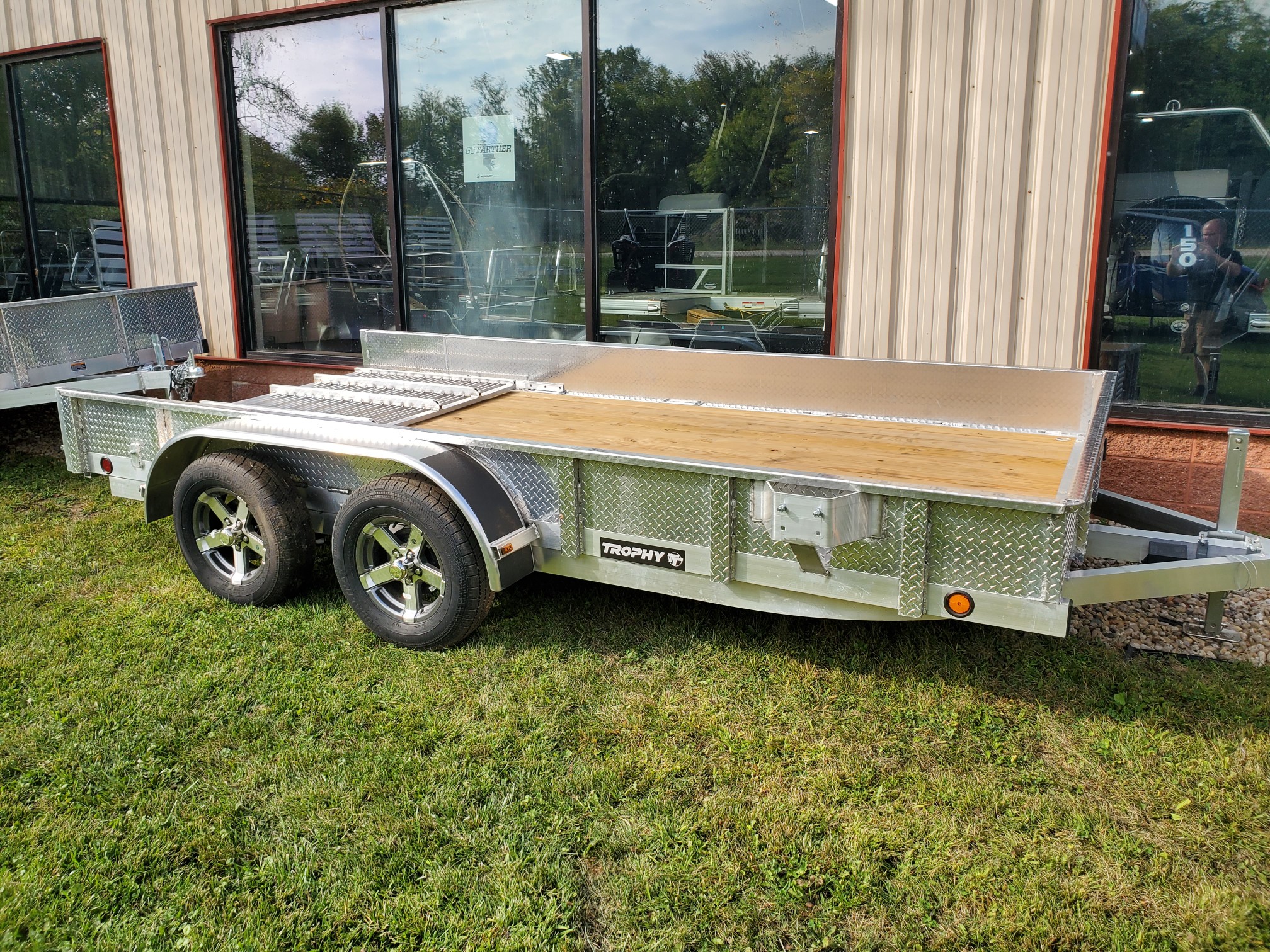 2025 Trophy Trailers Heavy Duty 7 X 14 Tandem axle, diamond plate sides, tip in ramp.
