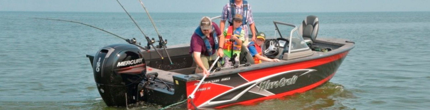 Men and children fishing in a MirroCraft fishing boat